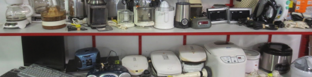 two shelves of various appliances
